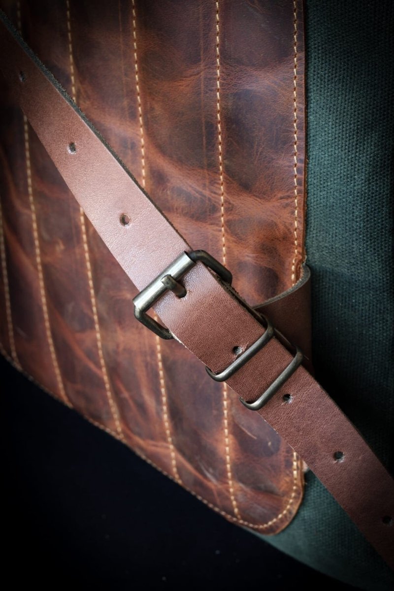 Handmade Leather & Canvas Laptop + Travel Backpack | Double Zippered Compartments | Axe Holder | Detachable Waist Belt DESCRIPTION 99percenthandmade