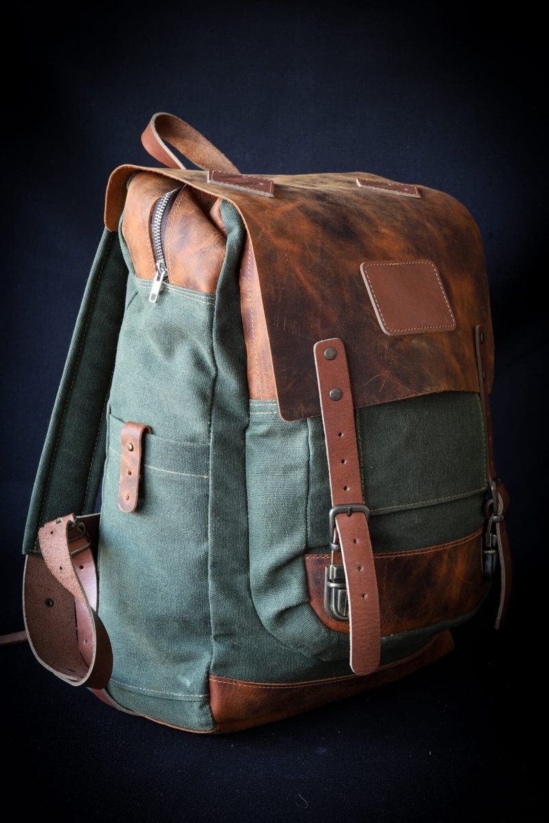 Handmade Leather & Canvas Laptop + Travel Backpack | Double Zippered Compartments | Axe Holder | Detachable Waist Belt DESCRIPTION 99percenthandmade